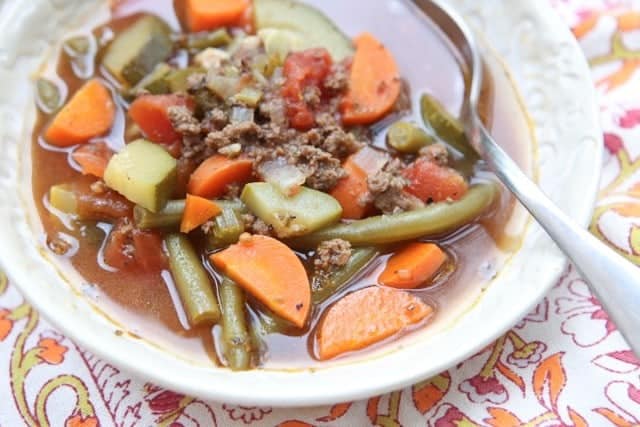 Break out the vegetables for this easy Italian Vegetable Beef Soup recipe. It's loaded with great vegetables like zucchini, squash and carrots. Healthy comfort food! #soup #vegetablesoup #beef #beefrecipe #souprecipe #lowcarbrecipe #healthysouprecipe #healthyrecipe