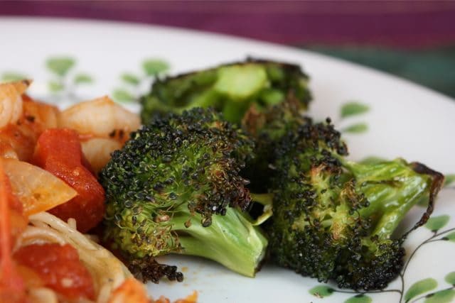 This super simple Roasted Broccoli has been a game changer as far as getting my kids to eat their veggies. I make broccoli this way at least once a week!