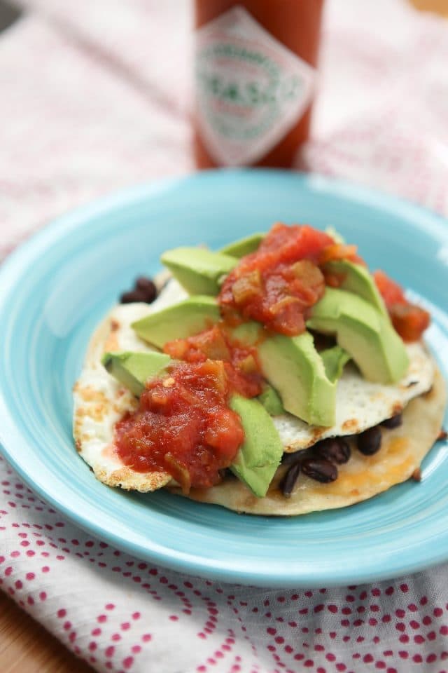 Change up your egg and toast breakfast (or dinner) routine with these simple and healthy Black Bean and Egg Tostadas - comes together in just minutes with just a few staple ingredients. Recipe via aggieskitchen.com