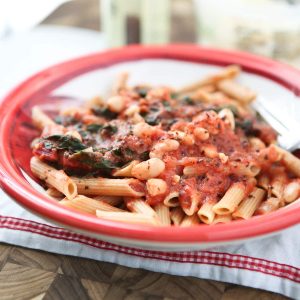 Swiss Chard With White Beans In Tomato Sauce Over Pasta