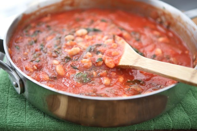 Swiss Chard with White Beans over Pasta - whole wheat pasta, greens and beans make this dish a hearty vegetarian pasta meal! Recipe via aggieskitchen.com