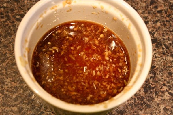 seasoning for a healthy salmon and veggie stir fry dinner in a bowl