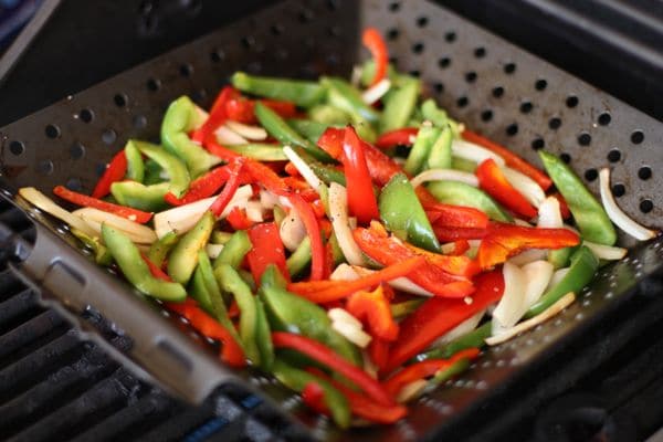 vegetables being cooked on a grill