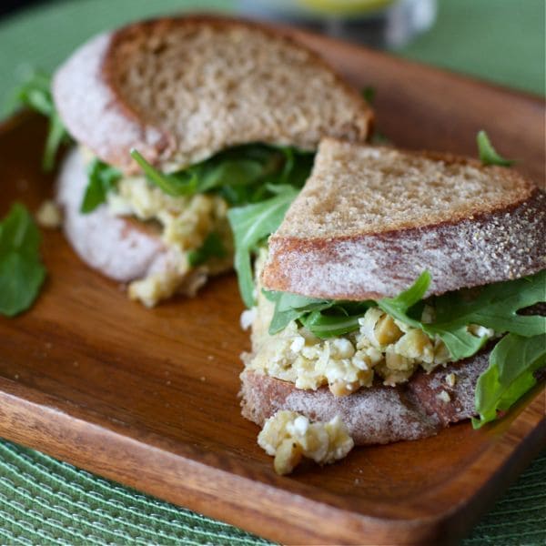 lemony chickpea and avocado sandwich with feta and arugula