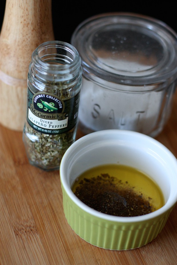 olive oil in a small container with jalapeno seasoning and salt