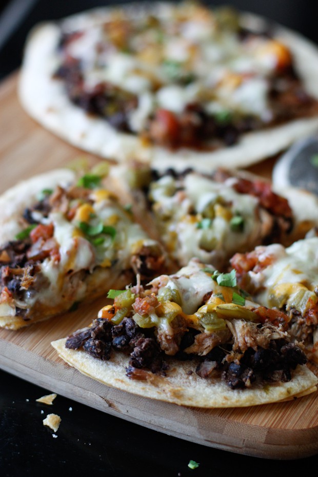 Loaded with pulled pork, beans and cheese this Mexican Black Bean Pizza will satisfy any appetite or craving! Recipe via aggieskitchen.com