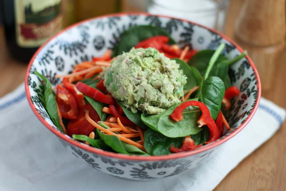 Perfect for a quick and light lunch or dinner, this protein packed Avocado Tuna Spinach Salad will get you back into warm weather clothes comfortably in no time.