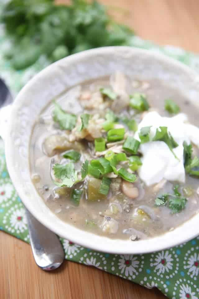 bowl of white chicken chili with array of toppings