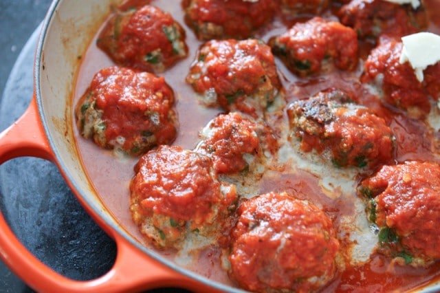 Baked Spinach and Ricotta Meatballs are easy to make and will be a family favorite! Perfect addition to Sunday Supper! Recipe via aggieskitchen.com