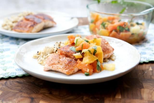 Blackened Salmon with Citrus Salsa is the perfect balance between spicy and sweet. Simple to prepare and makes a fresh, light dinner perfect for weeknights! Recipe via aggieskitchen.com