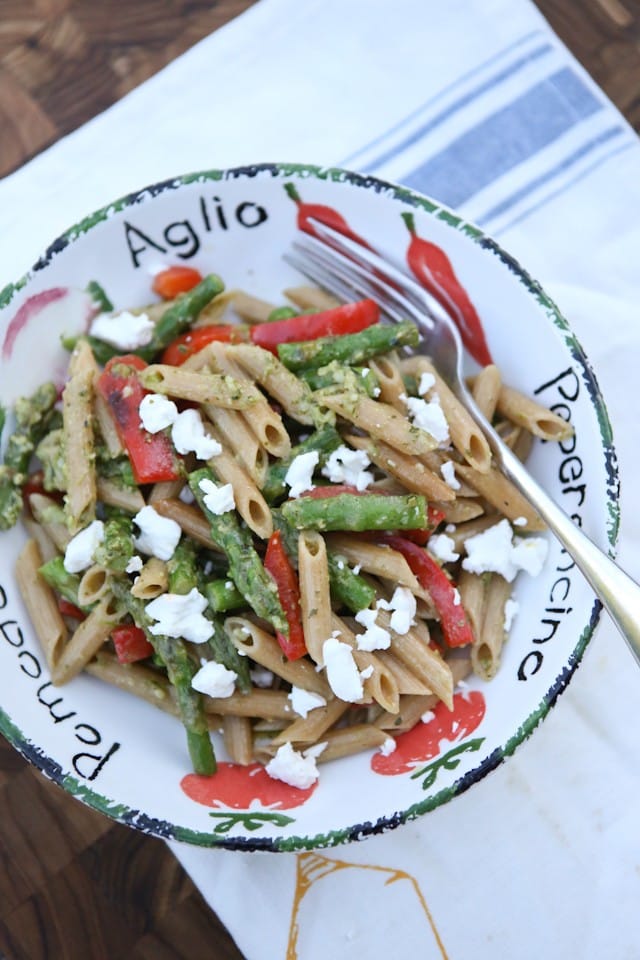 A delicious spring whole wheat pasta dish! Spring Vegetable Pasta with Pesto is bulked up with asparagus, red pepper and peas tossed in a light pesto sauce. Recipe via Aggie's Kitchen