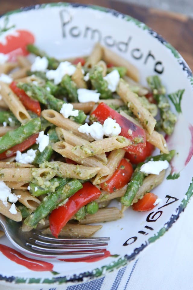 A delicious spring whole wheat pasta dish! Spring Vegetable Pasta with Pesto is bulked up with asparagus, red pepper and peas tossed in a light pesto sauce. Recipe via Aggie's Kitchen
