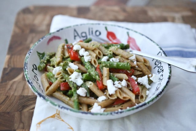A delicious spring whole wheat pasta dish! Spring Vegetable Pasta with Pesto is bulked up with asparagus, red pepper and peas tossed in a light pesto sauce. Recipe via Aggie's Kitchen