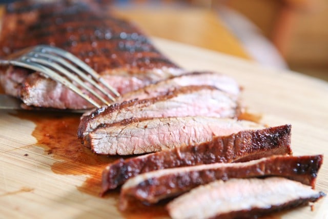 Grilled Flank Steak seasoned with a flavorful blend of brown sugar, chili powder, smoked paprika & cinnamon - fire up your grill for this one this weekend!