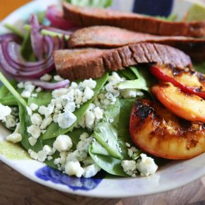 Steak Spinach Salad with Grilled Peaches and Red Onion