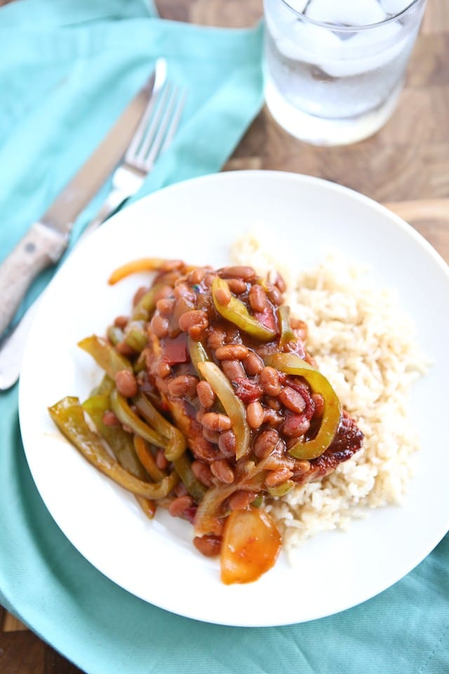 Grilled Pork Chops smothered in a special sauce made with baked beans, peppers and onions. So flavorful and an easy dinner to make - perfect for grilling season!