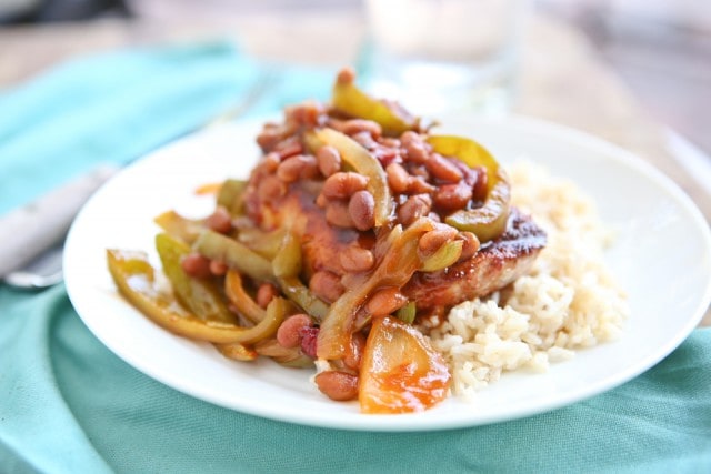 Grilled Pork Chops smothered in a special sauce made with baked beans, peppers and onions. So flavorful and an easy dinner to make - perfect for grilling season!