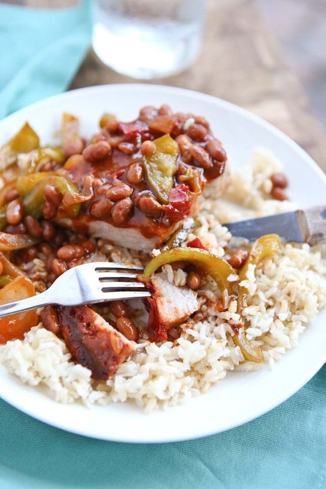 Grilled Pork Chops smothered in a special sauce made with baked beans, peppers and onions. So flavorful and an easy dinner to make - perfect for grilling season!