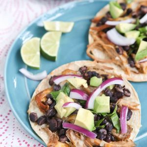 Slow Cooker Salsa Verde Pork Tostadas - all you need is a few ingredients and a little help from your slow cooker to put together this delicious, healthy baked tostada dinner your whole family will love.