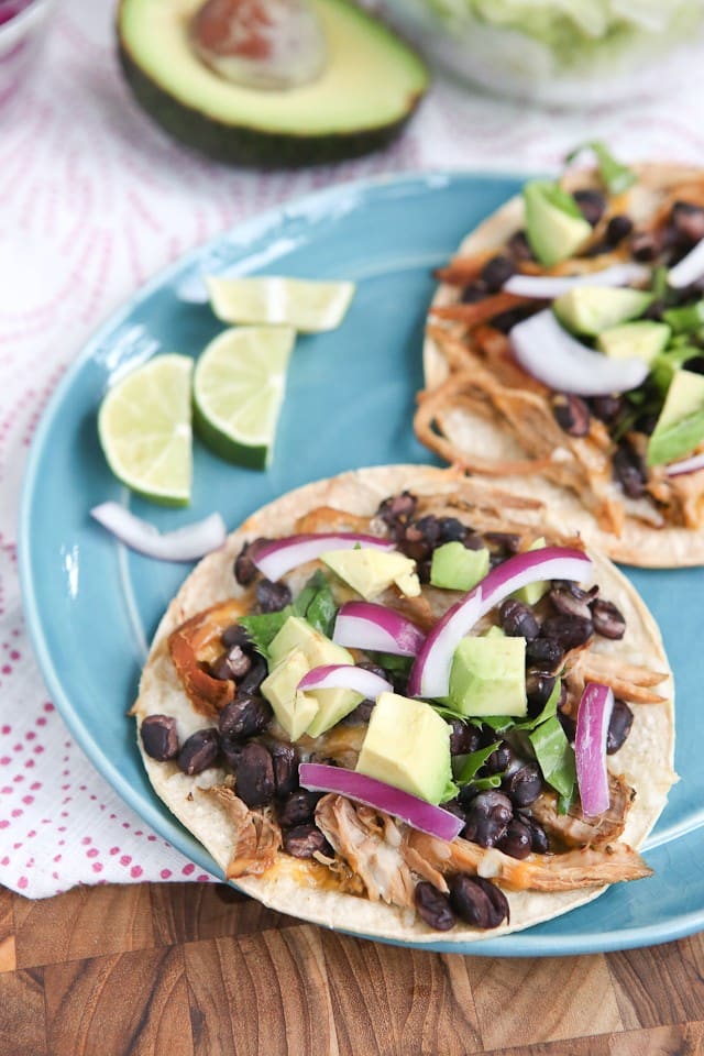 Slow Cooker Salsa Verde Pork Tostadas - all you need is a few ingredients and a little help from your slow cooker to put together this delicious, healthy baked tostada dinner your whole family will love.