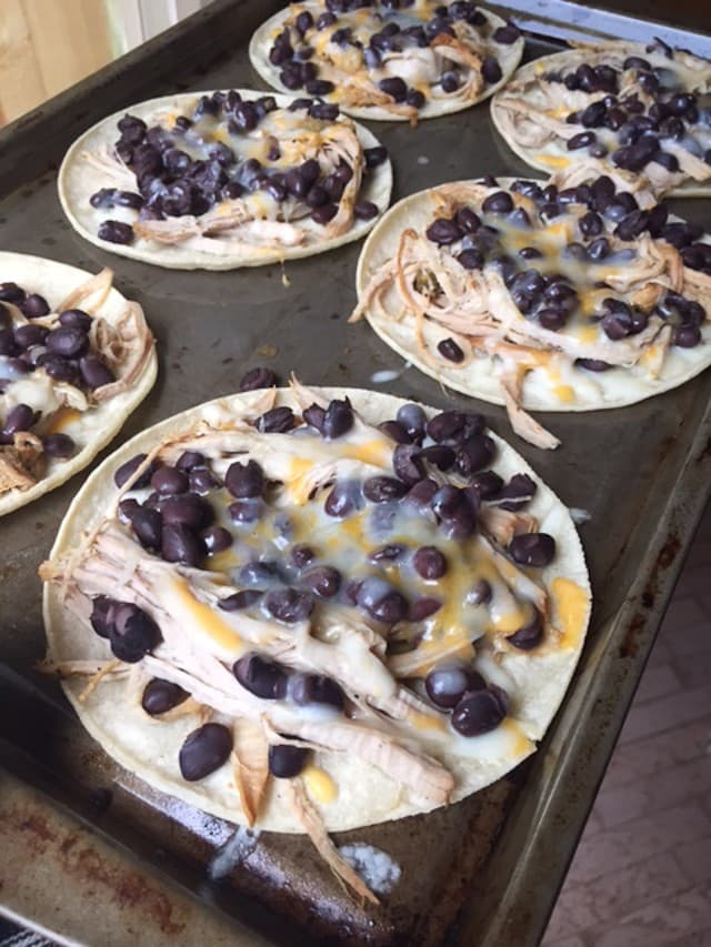 Slow Cooker Salsa Verde Pork Tostadas - all you need is a few ingredients and a little help from your slow cooker to put together this delicious, healthy baked tostada dinner your whole family will love.