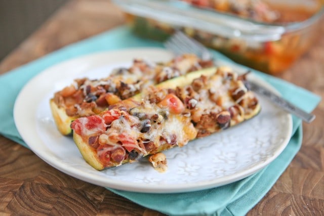 These Chili Stuffed Zucchini Boats are a great way to use up leftover chili from the weekend for an easy dinner. Delicious, filling and low carb!