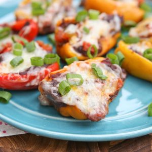 Mini Mexican Stuffed Peppers - baby bell peppers stuffed with black refried beans, salsa and cheese. Hard to resist!