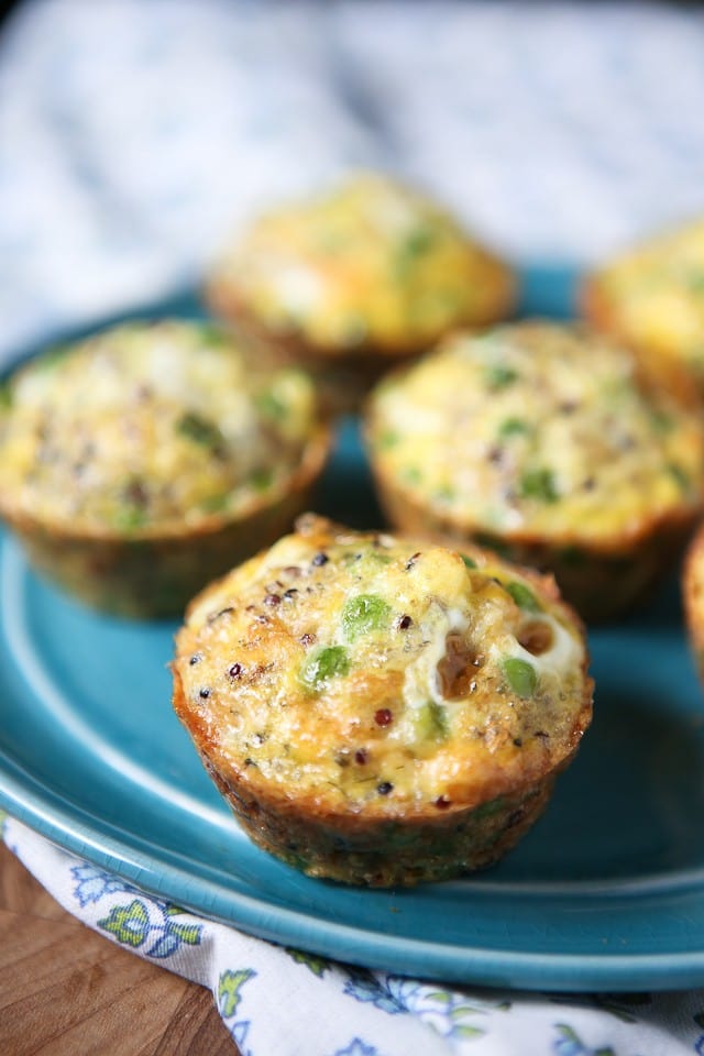 egg and quinoa muffins with peas on blue plate