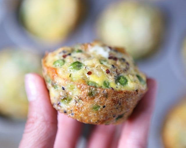 quinoa and egg muffin in someone's hands