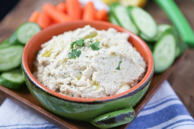 A great healthy snack or appetizer - grab your pita chips or veggies for this Lemony Artichoke Hummus dip.