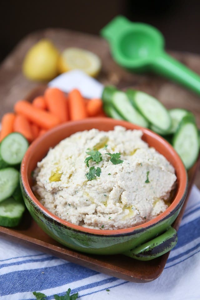 A great healthy snack or appetizer - grab your pita chips or veggies for this Lemony Artichoke Hummus dip.