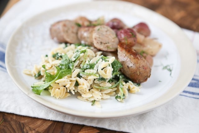 A simple side dish that is full of flavor! Creamy goat cheese and fresh arugula combined with warm orzo, your whole family will love this one.