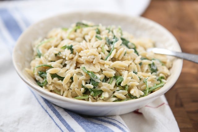 A simple side dish that is full of flavor! Creamy goat cheese and fresh arugula combined with warm orzo, your whole family will love this one.