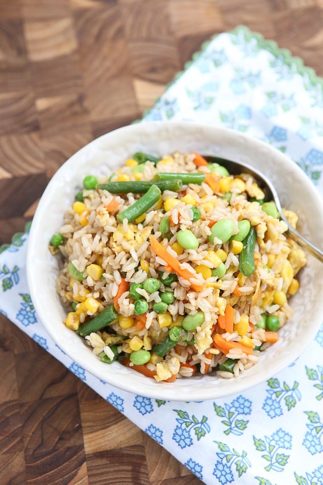 This Vegetable Fried Brown Rice comes together quick with just 5 ingredients. A tasty and healthy brown rice recipe perfect for meatless Mondays or a side dish on busy school nights.