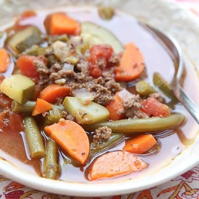 Break out the vegetables for this easy Italian Vegetable Beef Soup recipe. It's loaded with great vegetables like zucchini, squash and carrots. Healthy comfort food! #soup #vegetablesoup #beef #beefrecipe #souprecipe #lowcarbrecipe #healthysouprecipe #healthyrecipe