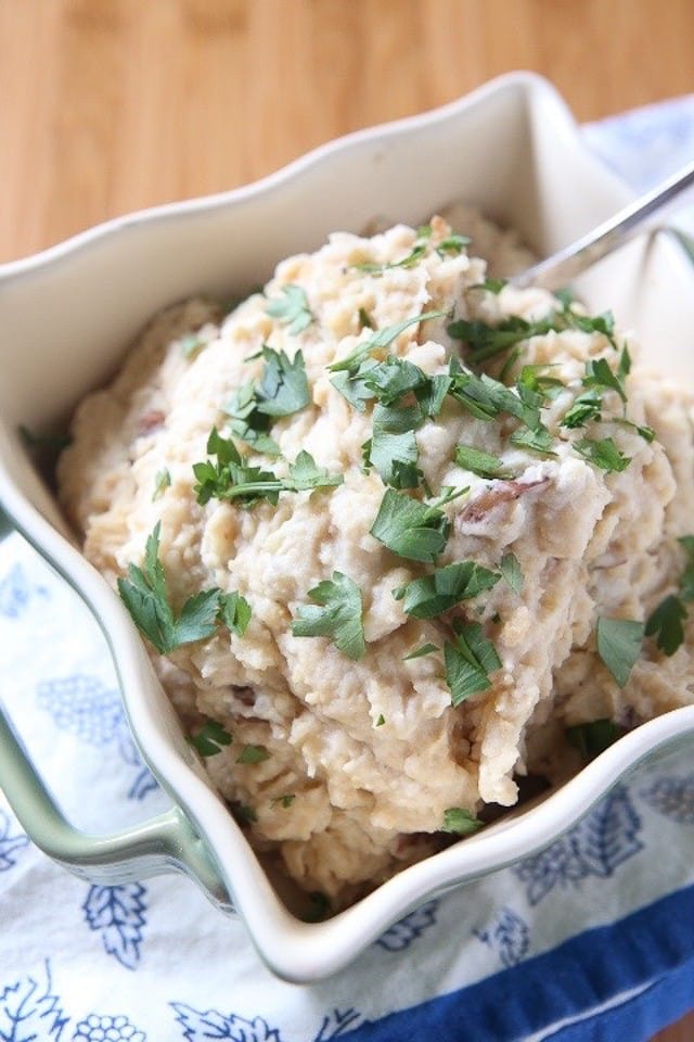 Add these light and creamy Slow Cooker Mashed Potatoes (with cauliflower & Greek yogurt) to your holiday menu. A family favorite recipe from Produce For Kids!