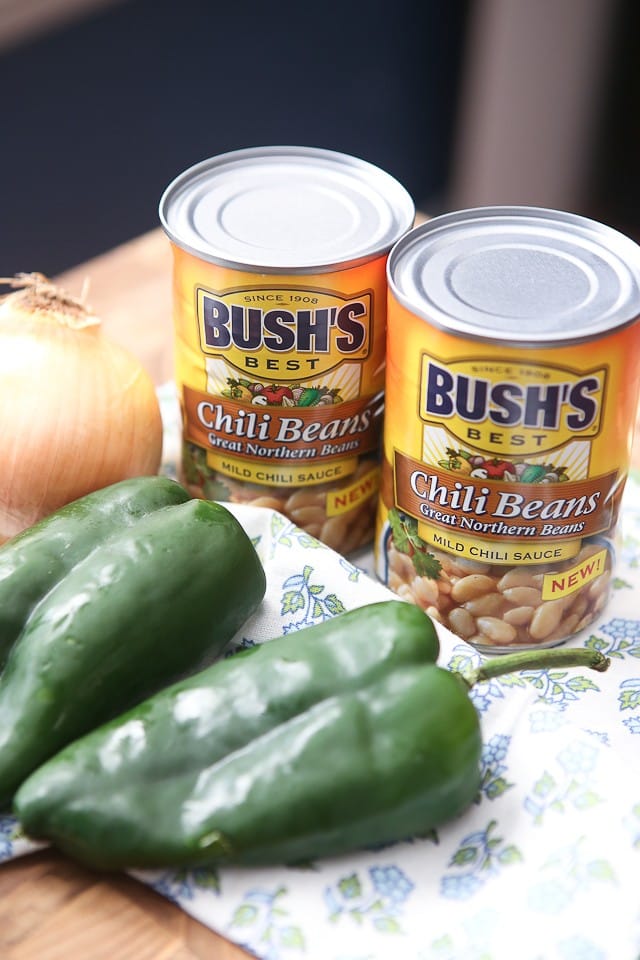 two cans of Bush's chili beans, a white onion, and two poblano peppers