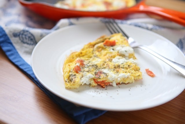 plate of cooked egg loaded with cheese and salmon