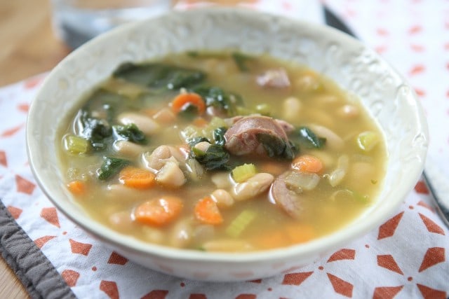 It's definitely soup season and one of my family's favorite soups is this Smoked Sausage and White Bean Soup with Spinach. It will warm you right up!
