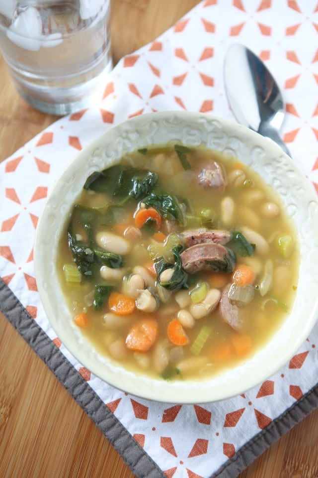It's definitely soup season and one of my family's favorite soups is this Smoked Sausage and White Bean Soup with Spinach. It will warm you right up!