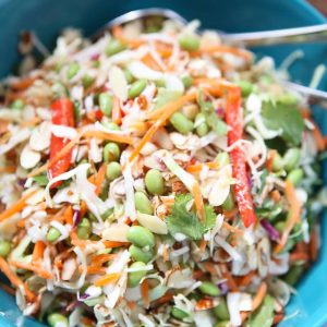 So light an fresh! This Asian Almond Slaw Salad is healthy and filled with crunch. Serve it at a barbecue or gathering for a crowd pleasing side dish! #FisherUnshelled