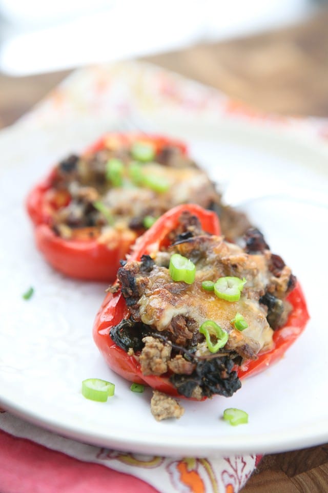 Simple and healthy, this low carb recipe for Beef and Spinach Stuffed Peppers were a hit at my house! 
