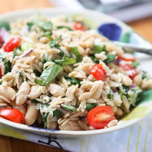 Orzo Salads are my favorite! This Tuna and Orzo Salad is packed with fresh spinach, tomatoes, Parmesan and basil - SO GOOD! Recipe from Andie Mitchell's Eating in the Middle: A Mostly Wholesome Cookbook, via aggieskitchen.com