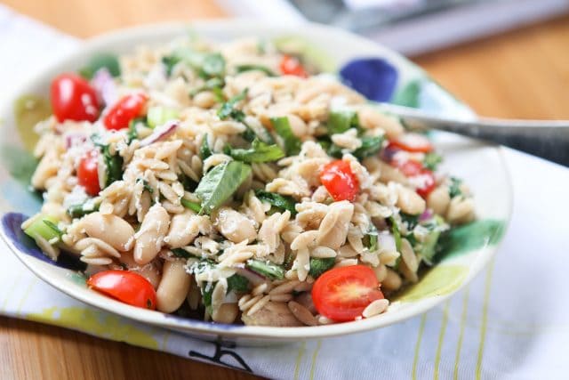 bowl with orzo, beans, cherry tomatoes, spinach, and tuna