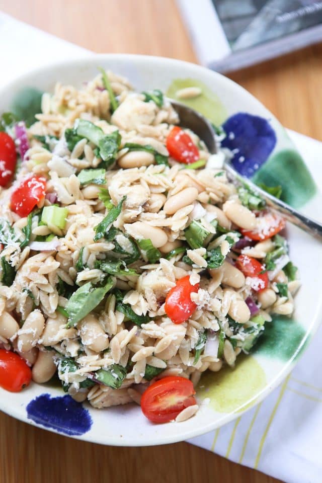 bowl with orzo, beans, cherry tomatoes, spinach, and tuna