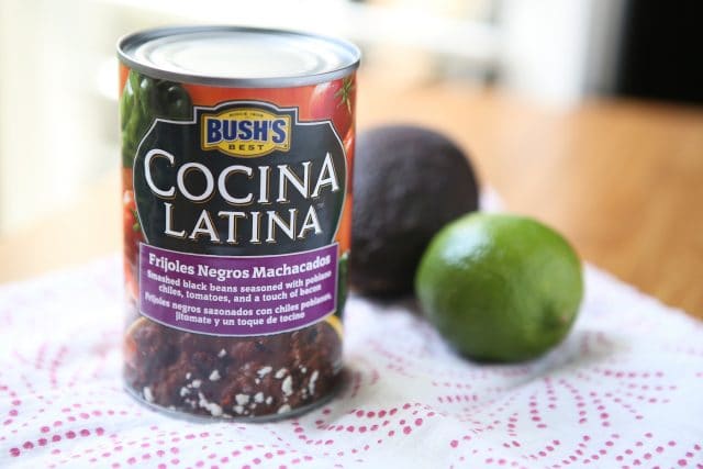 can of Bush's beans alongside an avocado and lime