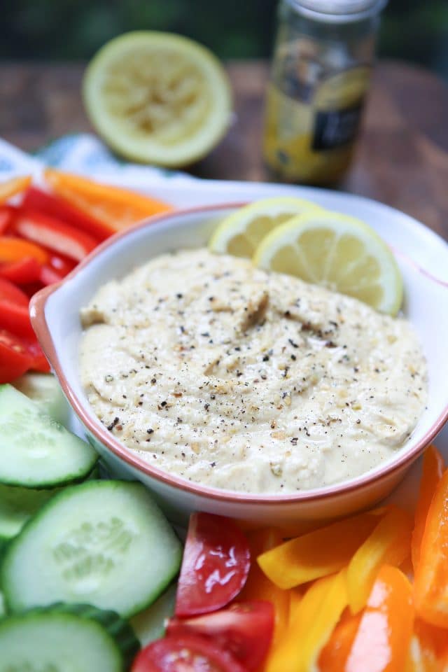 In need of an easy appetizer? Everyone loves a veggie plate! Spruce it up by serving fresh veggies with semi-homemade Lemon Pepper Hummus. Recipe via aggieskitchen.com #UnofficalMeal #NationalHummusDay