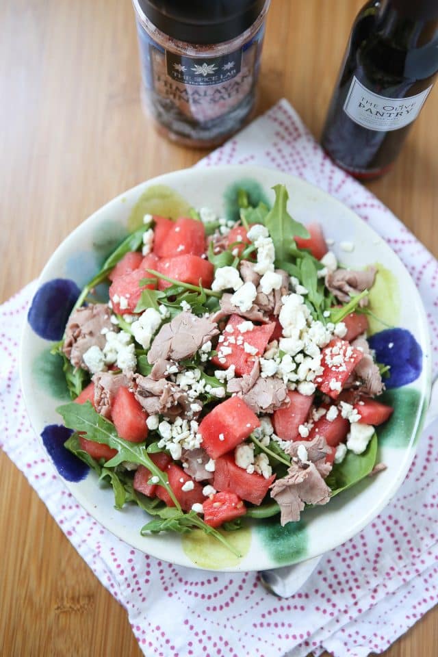 This salad screams summertime! Spinach and Arugula Salad with Watermelon, topped with sliced roast beef for protein - so easy to put together and enjoy for lunch or dinner. recipe via aggieskitchen.com