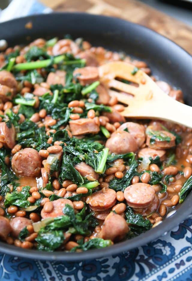 Easy comfort food your family will love! Baked Bean, Sausage & Kale Skillet - comes together fast, perfect for busy weeknights! Recipe via aggieskitchen.com