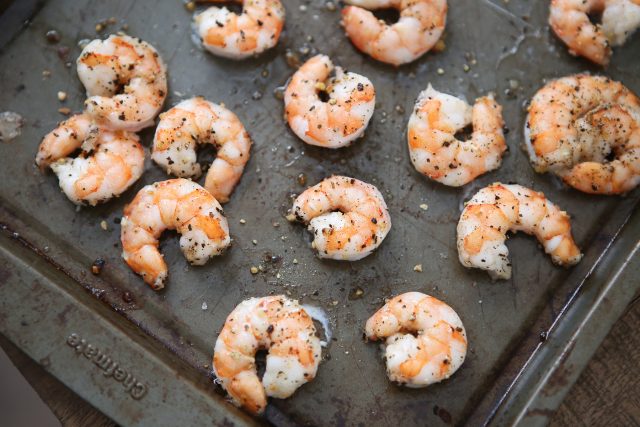 cooked shrimp on a baking sheet